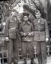 [GIs Chrzanowski and Landry with African soldier]