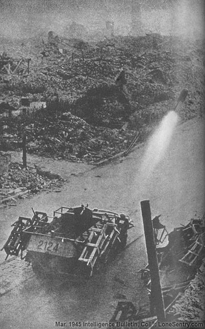 [The Wurfrahmen 40 is here shown in action. Four wooden rocket-carrying crates are in place on the plates on the side of the half-track. The last of the four rockets has just been fired.]