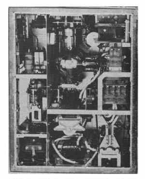 [Figure 340. Model 94 Type 1. Transmitter. Rear view. 140-15000 KC. MOPA. 275 watts. Tube at left of photo is Japanese Type UY511-B master oscillator. Two screen grid tubes in center are parallel connected PA Tubes, Japanese Type UV812.]